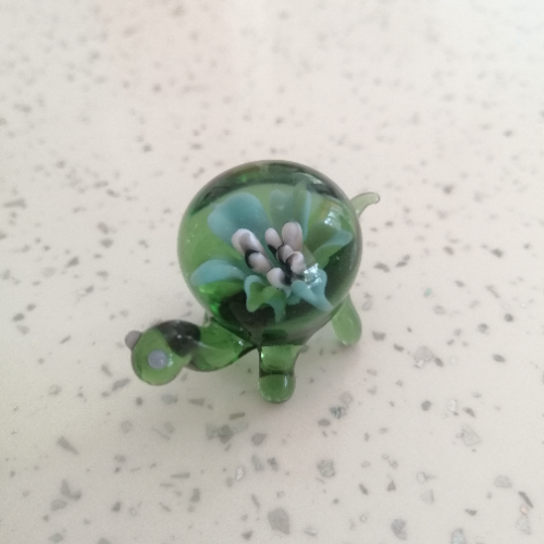 Green Tortoise with Green, Blue, White and Black Flower